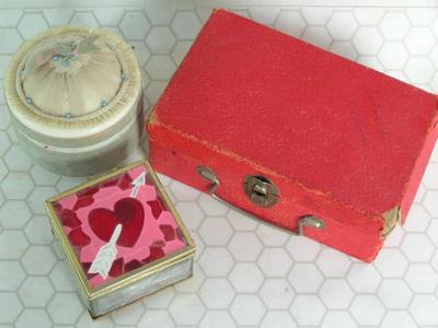 Three containers full of buttons