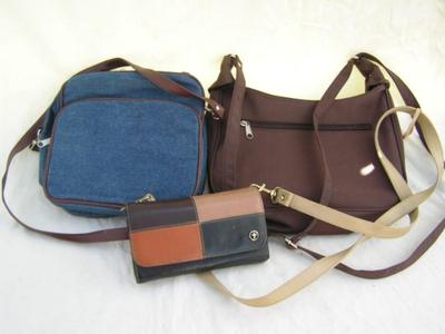 Two hand bags and a clutch