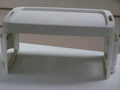 Folding bed tray/table. Breakfast in bed anyone. Plastic construction.