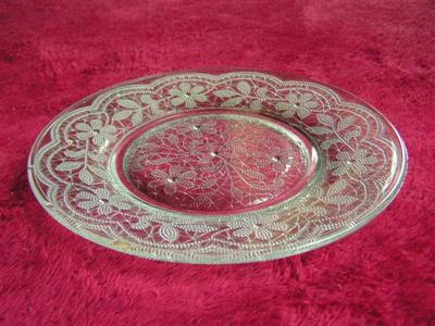 Clear glass sandwich/salad plate Poesy pattern w/ footed bottom.
