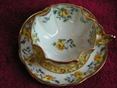 Vintage Napco of Japan Lusterware porcelain 3-footed teacup and saucer