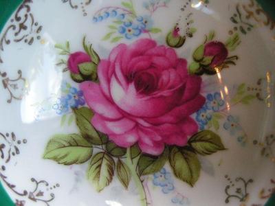 Vintage porcelain (Japan?) 3-footed teacup and saucer set