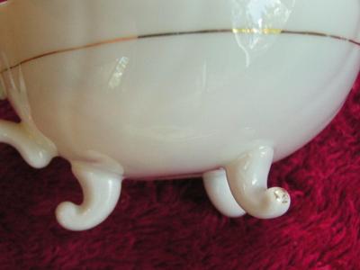 Vintage porcelain (Japan?) 3-footed teacup and saucer set