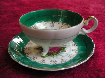 Vintage porcelain (Japan?) 3-footed teacup and saucer set
