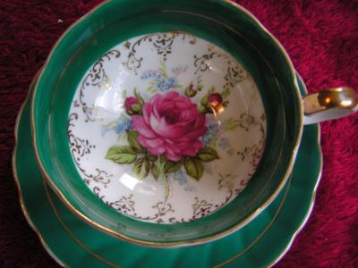 Vintage porcelain (Japan?) 3-footed teacup and saucer set