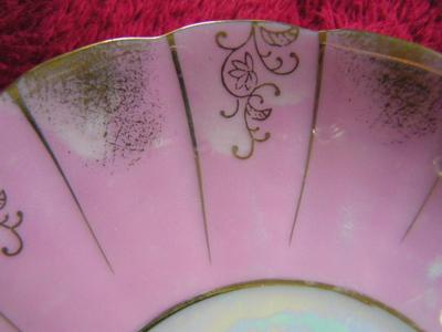 Vintage porcelain (Japanese?) 3-footed teacup and saucer set.