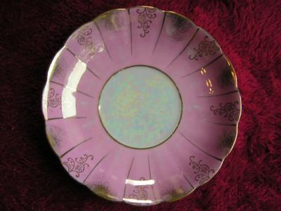 Vintage porcelain (Japanese?) 3-footed teacup and saucer set.