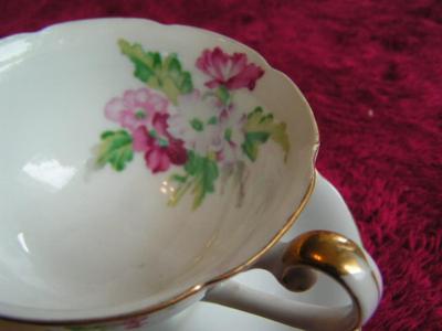 Vintage Ucagco of Japan porcelain teacup & saucer set.