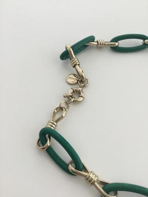 Gold tone green fashion T marked necklace