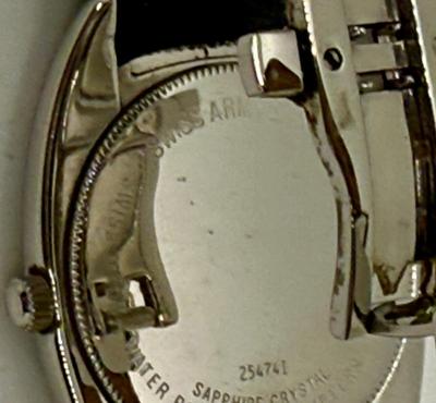 Sale Photo Thumbnail #25: With black leather band.  Sapphire Crystal. Not running, most likely just needs a new battery. Minor scratches and wear marks on the case.