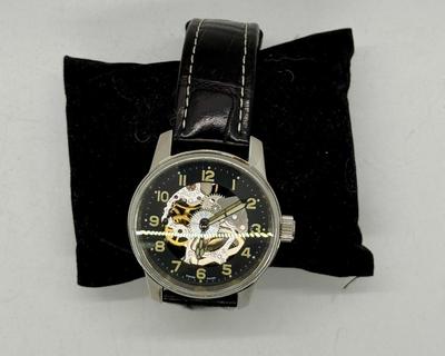Sale Photo Thumbnail #1: Swiss made, stainless steel back.  Black leather band, luminous hands.  Manual winding, tested, runs as expected.  Good condition, includes wood and felt storage box.