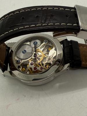 Sale Photo Thumbnail #9: Swiss made, stainless steel back.  Black leather band, luminous hands.  Manual winding, tested, runs as expected.  Good condition, includes wood and felt storage box.