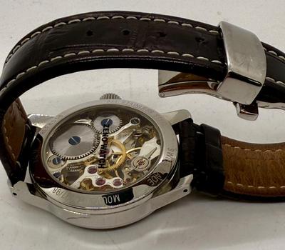 Sale Photo Thumbnail #6: Swiss made, stainless steel back.  Black leather band, luminous hands.  Manual winding, tested, runs as expected.  Good condition, includes wood and felt storage box.