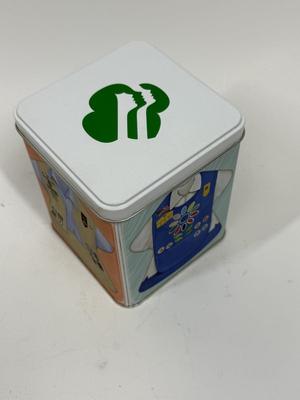 Sale Photo Thumbnail #514: Collectible Metal Tin with snap-down lid.  Images of 4 different Girl Scout uniforms. No dents or scratches.