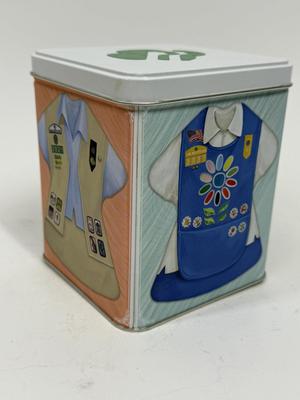 Sale Photo Thumbnail #513: Collectible Metal Tin with snap-down lid.  Images of 4 different Girl Scout uniforms. No dents or scratches.