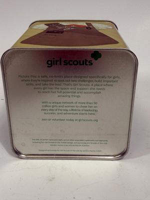 Sale Photo Thumbnail #515: Collectible Metal Tin with snap-down lid.  Images of 4 different Girl Scout uniforms. No dents or scratches.