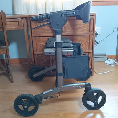 LOT 143: Triumph Escape Rollator Foldable Walker with Seat, White Wicker Wall Cabinet & Chrome Shoe Rack