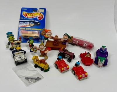 Sale Photo Thumbnail #615: (2) Mickey Mouse Pull Back toy 1988 
(1) Snoopy Die-cast Metal Train Avila Collectible 
(1) Disney ~ Snow White & The Seven Dwarfs - Mine Train Rail Car
(1) Matchbox Lesley Mod Tractor 1972 
(1) Donald Duck Policeman in. Patrol Car Pull-back toy
(1) New i