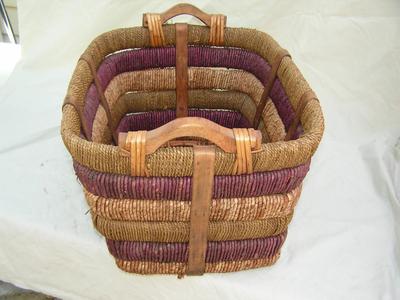 Very sturdy wicker basket wrapped in cordage.