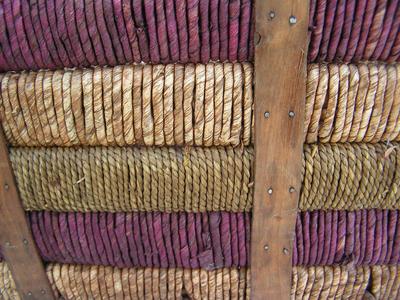 Very sturdy wicker basket wrapped in cordage.