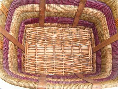 Very sturdy wicker basket wrapped in cordage.