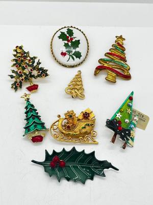 LOT: 191J: Christmas Brooch Lot: Avon, AJMC and More
