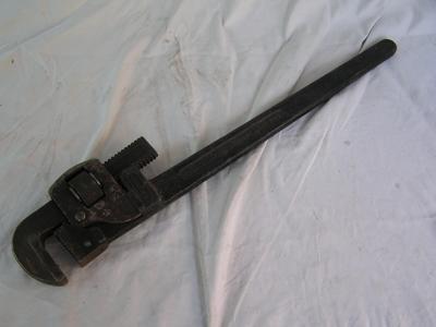 Good heavy steel pipe wrench w/good sharp teeth,