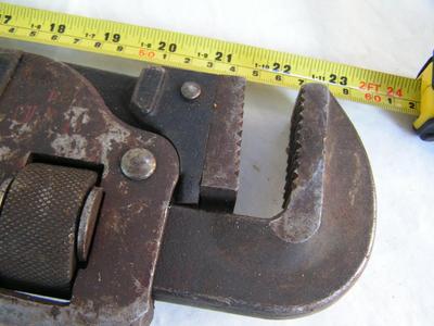 Good heavy steel pipe wrench w/good sharp teeth,