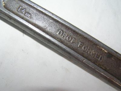 Small pipe wrench, labeled 14", good teeth.