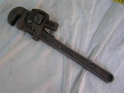 Small pipe wrench, labeled 14", good teeth.