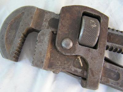 Small pipe wrench, labeled 14", good teeth.