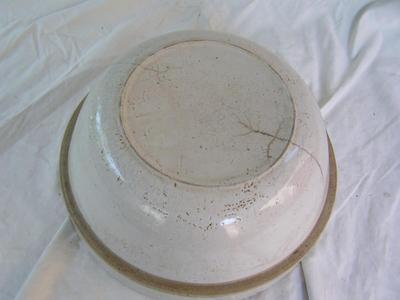 Big ol’ “stoneware” bowl. 11" I.D at top x 5-1/2" deep. Maybe antique??