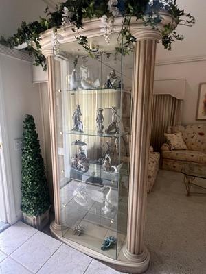 Sale Photo Thumbnail #17: Center Glass display area is rectangular, viewable from front and back.  Glass shelves, tap contains lights.  Great condition, measures approx. 80" tall, 40" wide and 16" deep. Pickup will be arranged from very local home in Brea. Pictured Figurines not i