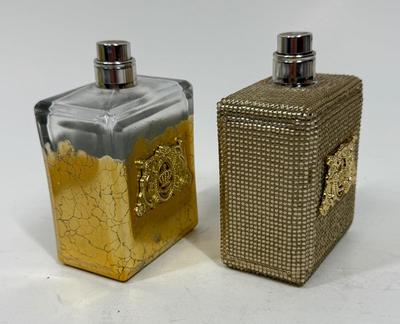 Sale Photo Thumbnail #223: Viva La Juicy Limited Edition 3.4oz Parfum Spray with gold beaded glass bottle (still contains some perfume), and another Viva La Juicy Limited Edition 3.4oz Parfum Spray with gold gilt glass bottle (worn/crackled finish), that one appears to be empty.