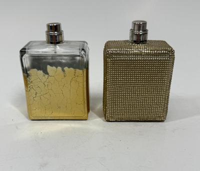 Sale Photo Thumbnail #222: Viva La Juicy Limited Edition 3.4oz Parfum Spray with gold beaded glass bottle (still contains some perfume), and another Viva La Juicy Limited Edition 3.4oz Parfum Spray with gold gilt glass bottle (worn/crackled finish), that one appears to be empty.