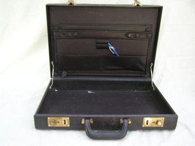 Old thin line style brief case, w/key. Fair condition.
