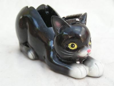 It’s a Scotch tape dispenser, in OEM box.