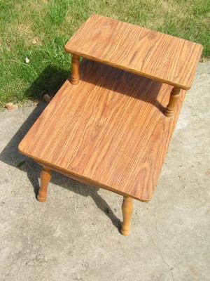 Step end table, melamine wood grain surface, fair condition