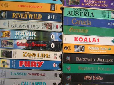 A box full of VHS movies, 38 of them