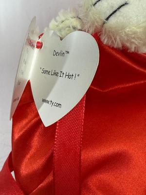 Sale Photo Thumbnail #438: In good condition. One devil is missing it;s ear tag.