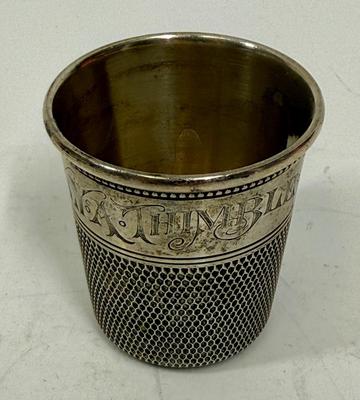 Sale Photo Thumbnail #460: In good condition, marked sterling along rim design. Approx. 1-7/8" tall.