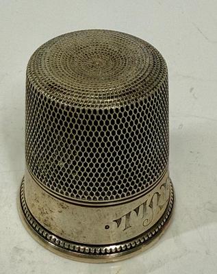 Sale Photo Thumbnail #458: In good condition, marked sterling along rim design. Approx. 1-7/8" tall.