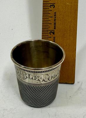 Sale Photo Thumbnail #457: In good condition, marked sterling along rim design. Approx. 1-7/8" tall.