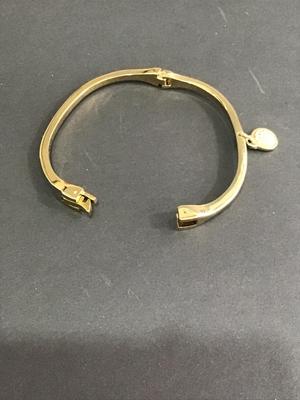 Very nice gold tone hinged bracelet