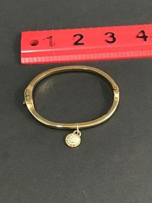 Very nice gold tone hinged bracelet
