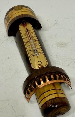 Sale Photo Thumbnail #98: Polished and stained wood lighthouse with brass and copper accents. Attached glass thermometer measures from 0 degrees C to 50 degrees C. Good condition, approx. 8" tall.