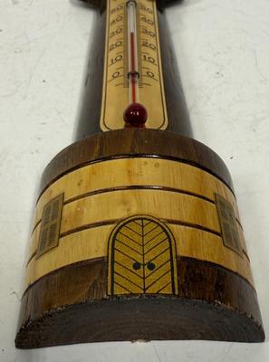 Sale Photo Thumbnail #99: Polished and stained wood lighthouse with brass and copper accents. Attached glass thermometer measures from 0 degrees C to 50 degrees C. Good condition, approx. 8" tall.