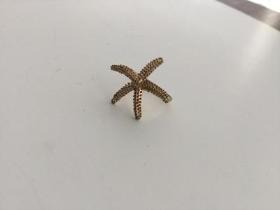 Gold tone unmarked starfish ring