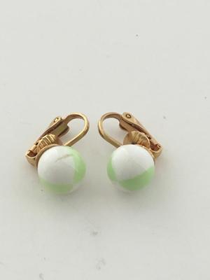 Gold tone clip on green and white earrings