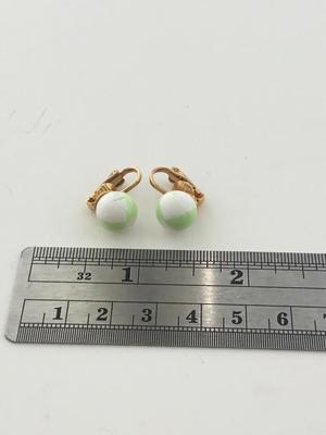Gold tone clip on green and white earrings